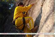 A student participating in a rock climbing activity during the winter camp.