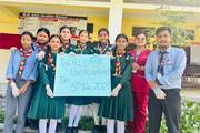 Scouts and staff members participating in an awareness initiative for World Environment Day.
