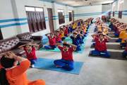 Students participating in a yoga session for holistic well-being.