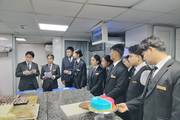 Students observing professional bakery techniques during an industry field visit.
