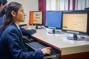 A student working on a computer during a lab session at Dibya Deep Jyoti English Secondary School.
