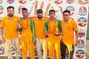 Victorious students showcasing their championship trophies