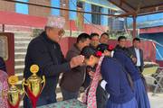 Prize distribution for district-level dance competition achievement.