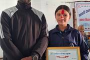 A student receiving recognition for securing third place in an inter-school elocution competition.