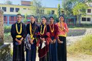Students dressed in traditional attire for a school cultural program.