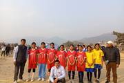 The girls' football team is participating in a sports event.