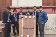 Grade 9 Civil Engineering students of Janata Secondary School showcasing their electrical wiring project.