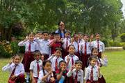 Grade II students of Nava Jyoti Secondary School exploring nature during an educational visit to the National Botanical Garden, Godavari.