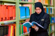 Students exploring a vast collection of academic resources in the library to enhance their learning experience.