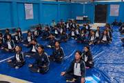 Students participating in meditation