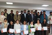 Students and faculty members of Metropolitan College gather to celebrate the formal distribution of Certificates of Membership