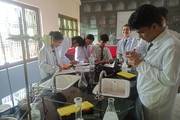 Hands-On Learning: Students Conducting Experiments in the Physical Lab at Janak Model Secondary School