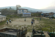 The school's academic building and playground providing a dedicated space for both learning and physical activities.