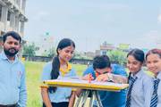 Civil engineering students of Shree Gautam Buddha Secondary School receive hands-on training during a practical surveying field session.