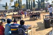 Students are participating in a quiz competition held on the school.