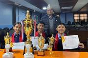 Janata Secondary School students celebrating their quiz competition victory.