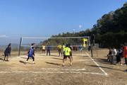 Students competing in a volleyball match during the annual sports day.