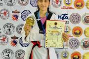A student securing a gold medal at the Indo-Nepal International Taekwondo Championship.