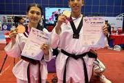 Students celebrating their achievements at a Taekwondo championship.