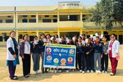 Students participating in a vaccination and health awareness initiative.