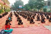 students participating in Yoga class in the school compound