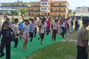 Students engaging in a yoga session to promote physical health and mental well-being.